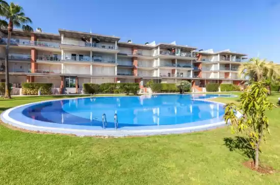 Apartment for 2 + 2 guests . With Pool, Air conditioning, Wifi and Optional FREE Cancellation  Happy in Urbanització Platja d'Oliva, Oliva, Valencia, Comunitat Valenciana, España